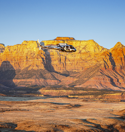 Our Zion National Park helicopter flight allows you to take in beautiful scenery of the Virgin River Valley with amazing panoramic views of West Temple and the large Crater Hill Volcano 